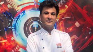 A book titled "Kitchens of Gratitude" authored by Chef Vikas Khanna_50.1