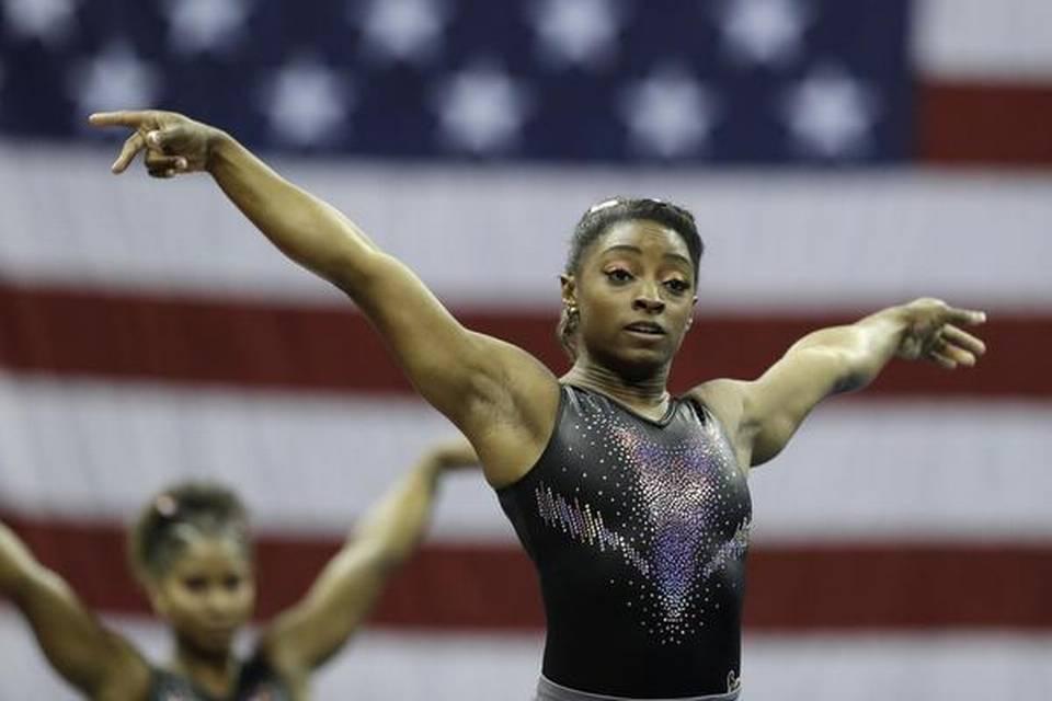 Simone Biles makes history with a "triple-double" twist_40.1
